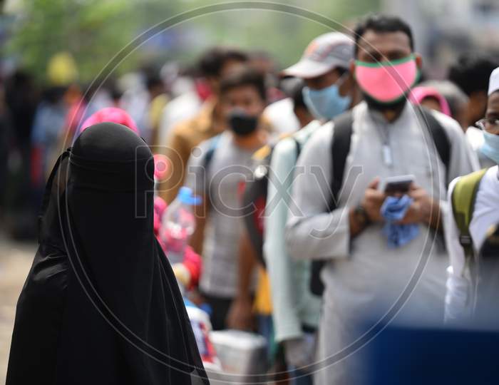 Migrants and Stranded people wait outside Secunderabad Railway Station to board trains as Indian Railways resumes transport services as government eases restrictions for the ongoing nationwide lockdown amid coronavirus pandemic. June 1, 2020, Hyderabad.