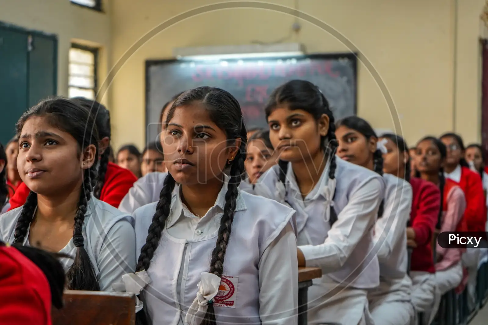 Image of New Delhi, Delhi/ India- June 1 2020: Girls Of Government School  Wearing Red Uniform, Meditating Before The Class Starts.-BH786363-Picxy