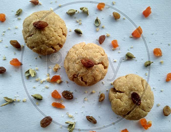 Wheat baked cookies sprinkled with some dry fruits