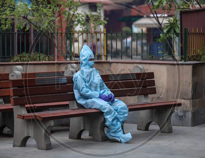A Relative Of The Deceased Covid-19 patient Wears Hazmat Suit to Perform The Last Rites At Nigambodh Ghat, On May 31, 2020 In New Delhi, India.