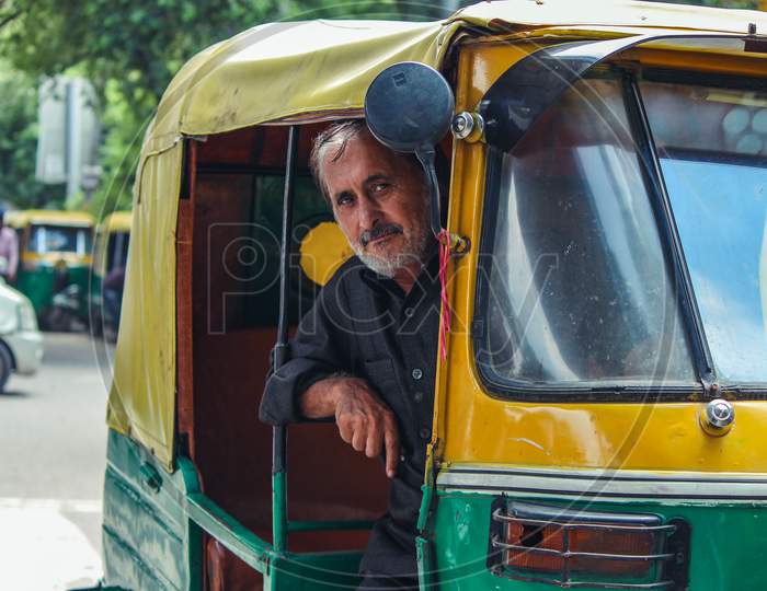 New Delhi, Delhi India- May 31 2020:A Portrait Of A Rickshaw Driver In Delhi, Smiling And Looking Into The Camera.