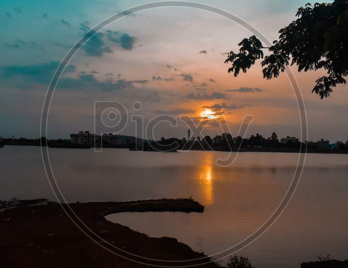 Sunrise Reflection On Lake