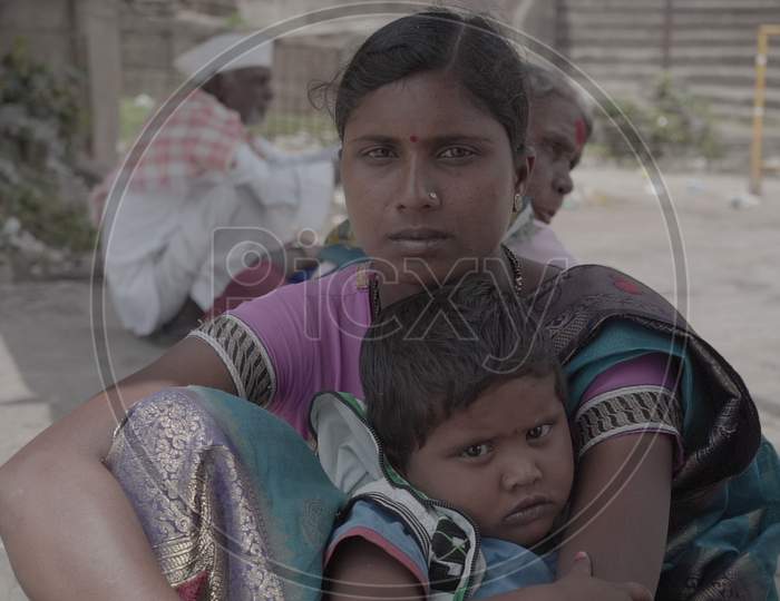 Indian Women Sitting with her child