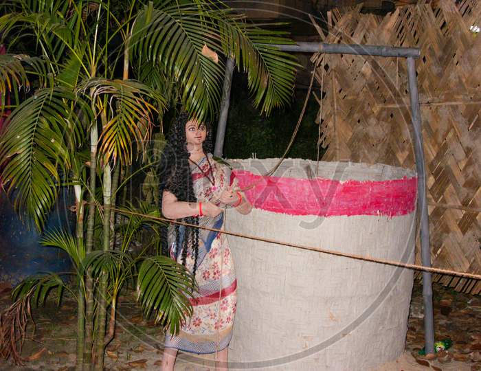 Clay Made Village Girl Taking Water From Well Made By Tribes Of Bengal