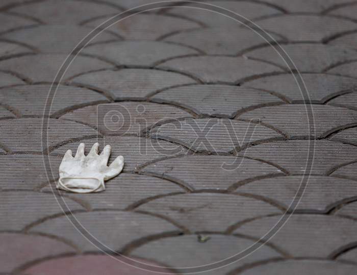 Discarded Latex Gloves Lie On The Ground After the cremation of The Deceased Covid-19 patient At Nigambodh Crematorium In New Delhi, India On May 31, 2020.