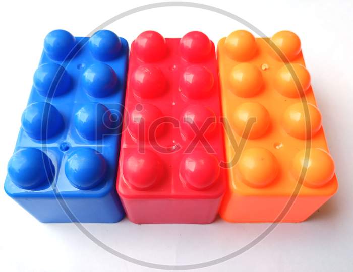 Top view on multi color toy bricks isolated on white  background