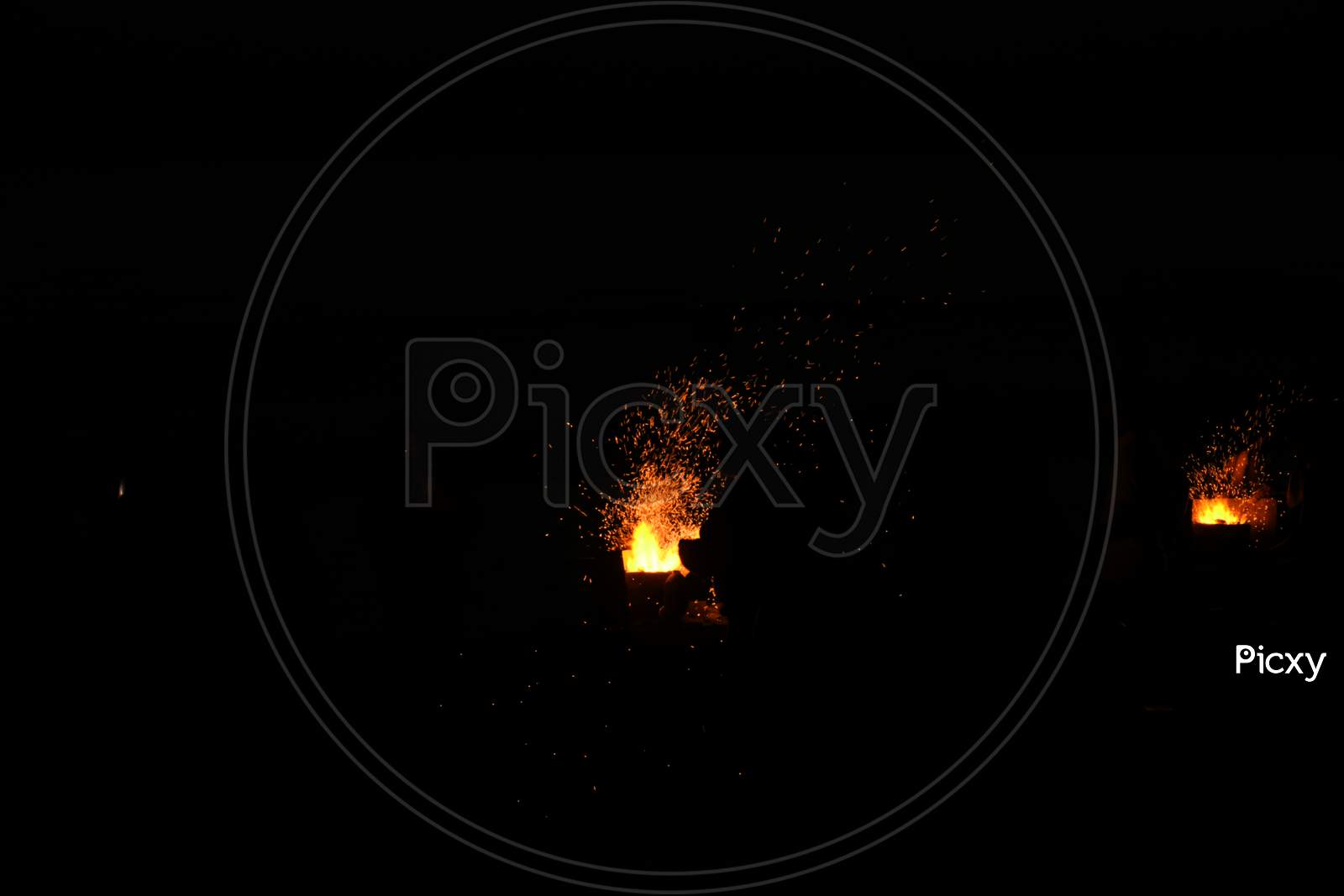 Amazing Sparks in the Dark. Beautiful abstract background on the theme of fire, light and life. Sparks fly in the sky