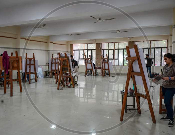 New Delhi, Delhi India- May 31 2020: Classroom Of An Art School, Students Maintains Social Distancing In The Class. Artists Busy In Painting.