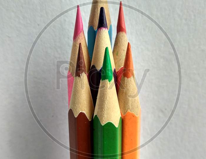 A bunch of colour pencils looking like a tower