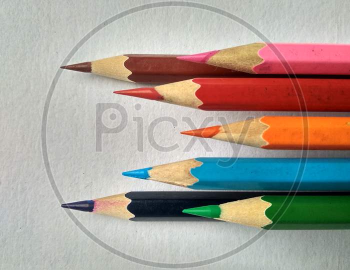 Colour pencils pointing to left side