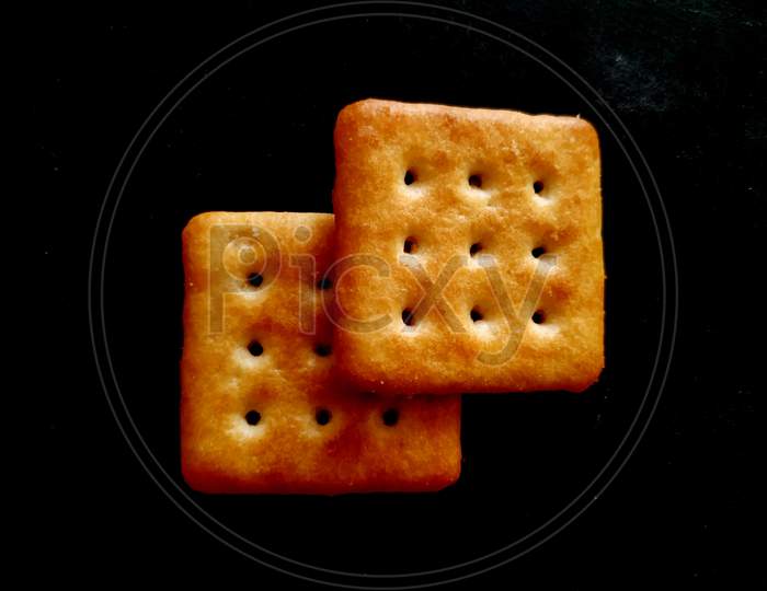 sweet fresh bake healthy brown biscuit isolated on black background