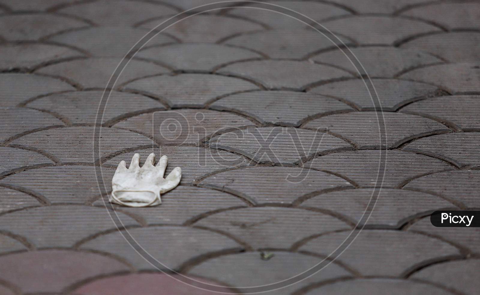 Discarded Latex Gloves Lie On The Ground After the cremation of The Deceased Covid-19 patient At Nigambodh Crematorium In New Delhi, India On May 31, 2020.