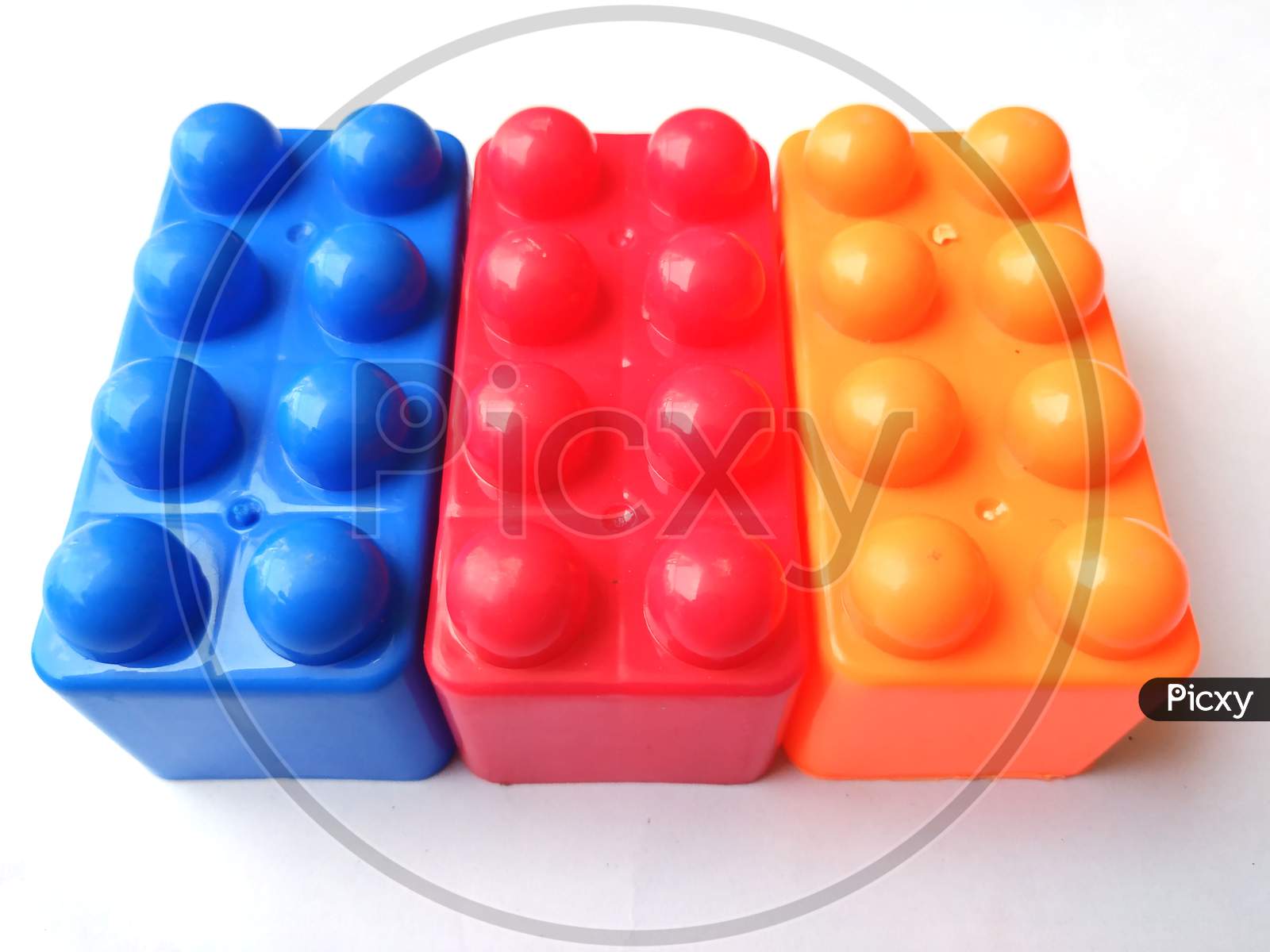 Top view on multi color toy bricks isolated on white  background