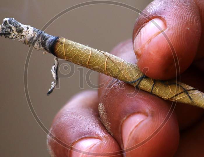 A Man Smokes 'Bidi' A Small Hand Rolled Cigarette On World No Tobacco Day In Ajmer, Rajathan, India On May 31, 2020.