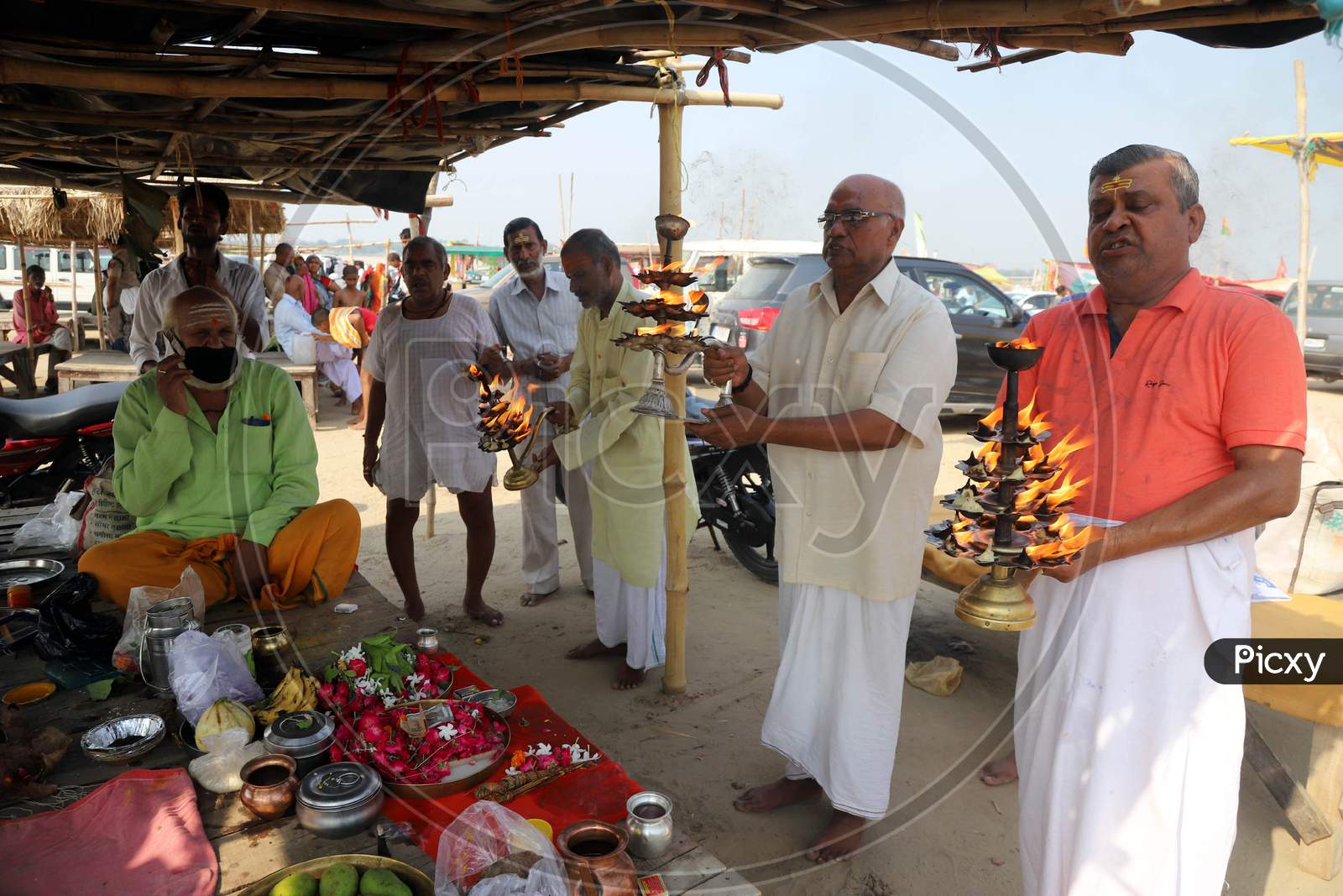 Hindu Devotees Offer Prayers After Taking  Holy Dip In The Ganga River During Nationwide Lockdown 5.0 for Coronavirus or COVID-19 Pandemic  In Prayagraj, June 10, 2020.