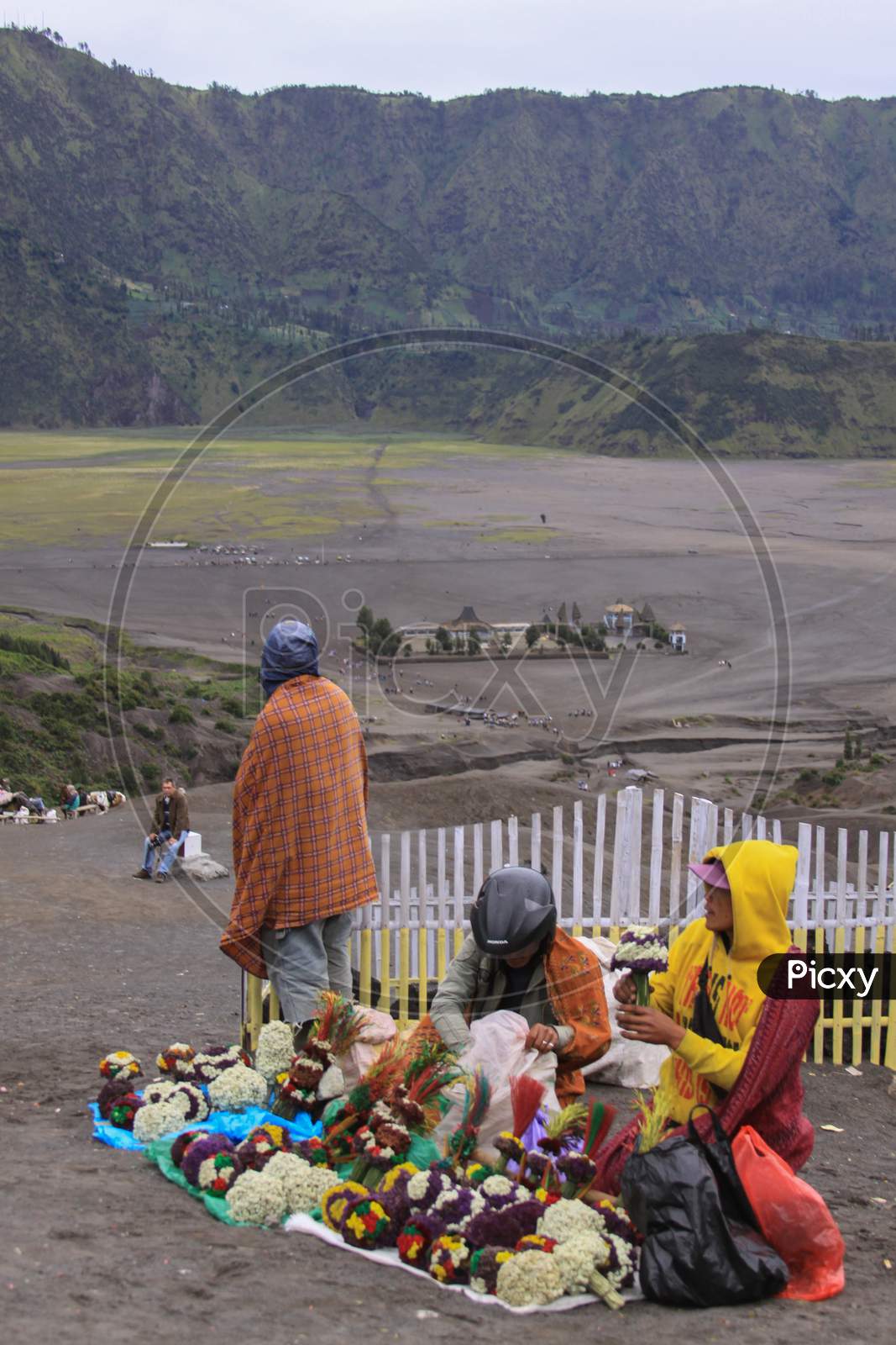 Indonesians Selling Flowers On Mount Bromo
