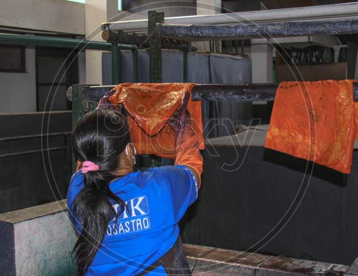 Worker Hang Wet Batik To Dry In Winotosastro