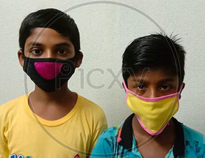 Corona virus protection by face mask.Two boys wearing mask for air pollution with white background.