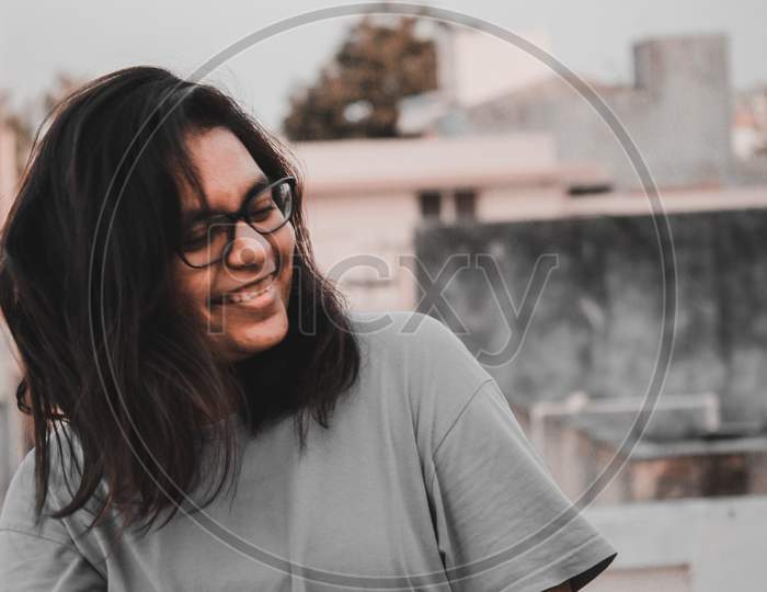 Girl smiling hair glasses