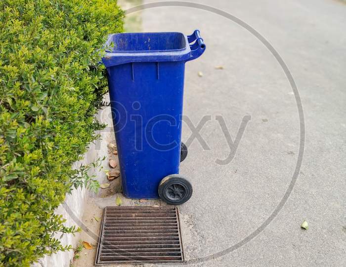 Blue Colored Dustbin At Roadside To Keep City Clean