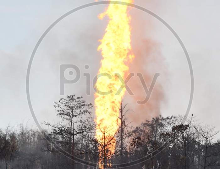 Flames And Smoke Come Out From A Well Run By State-Owned Oil India In Tinsukia District Of Assam On June 10,2020.