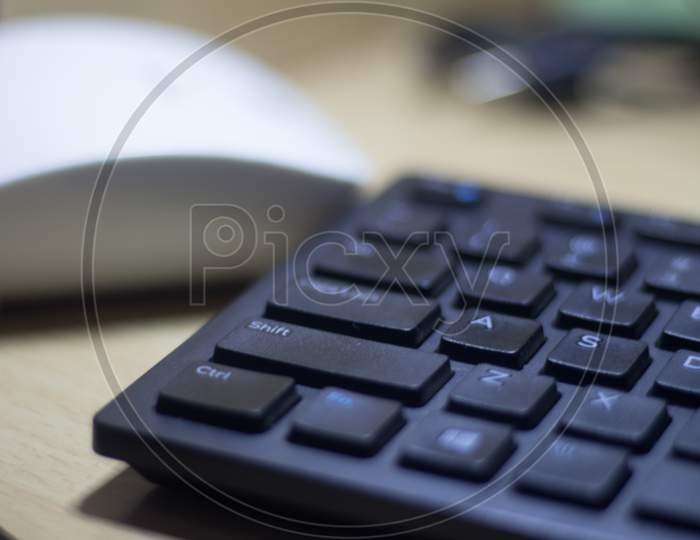 Computer Keyboard Closeup In Black Backlight