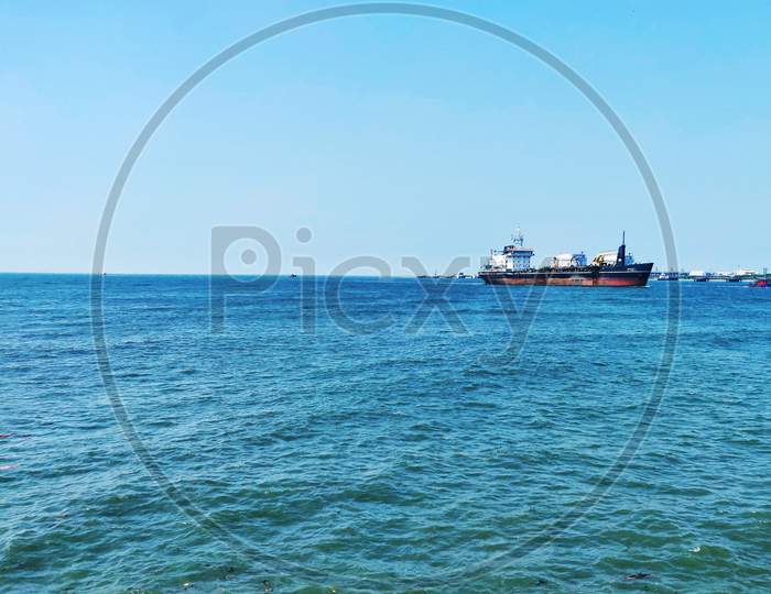 A Cargo Ship Cruising On The Arabian Sea In Kochi, Kerala, India. Kochi Port.