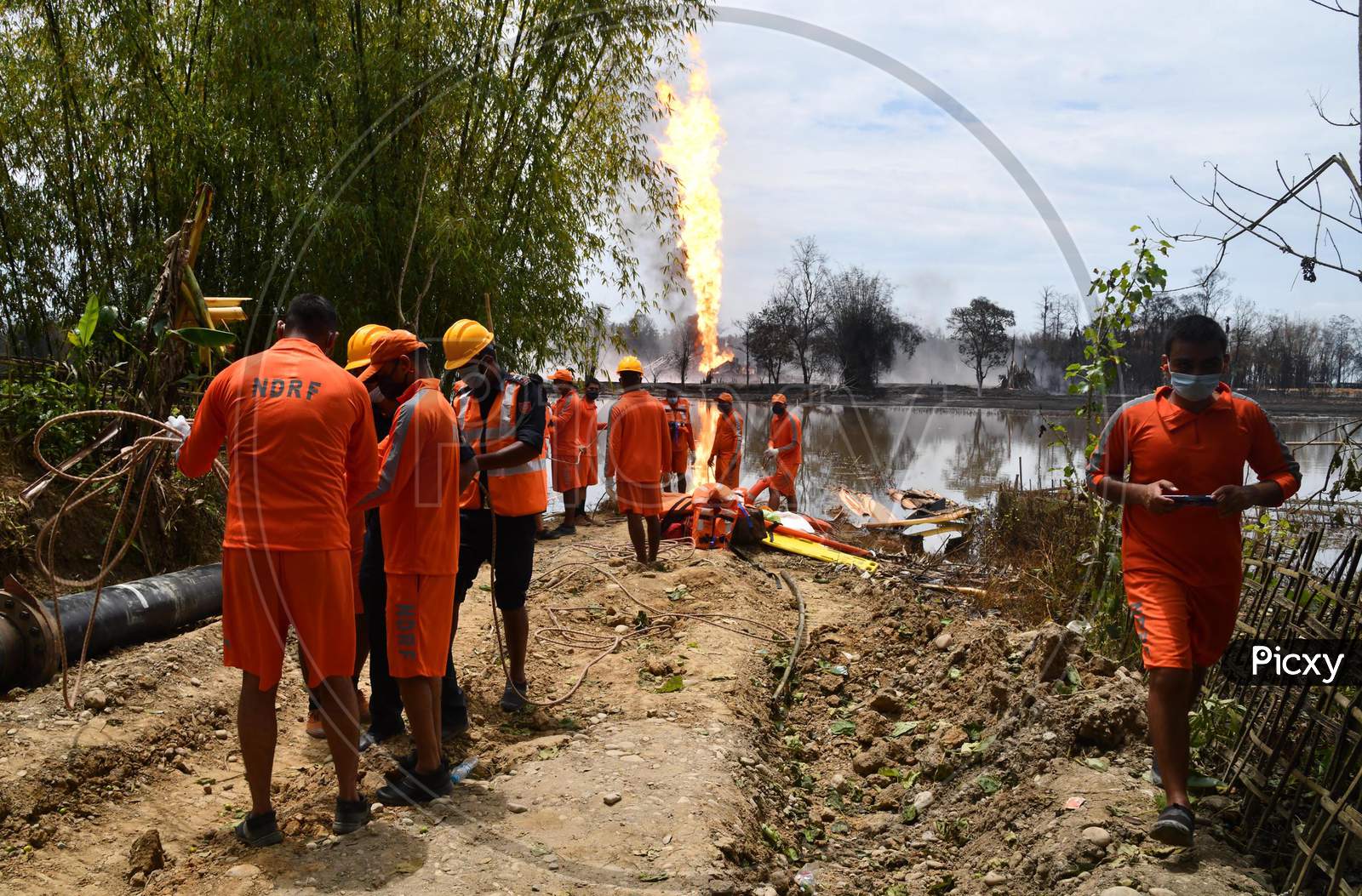 Rescue Workers Recover A Body Of A Worker Following An Explosion At A Well Run By State-Owned Oil India In Tinsukia On June 10,2020.
