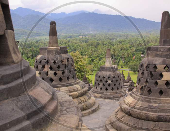 Stupas And Mountains At Borobudur Temple Sunrise