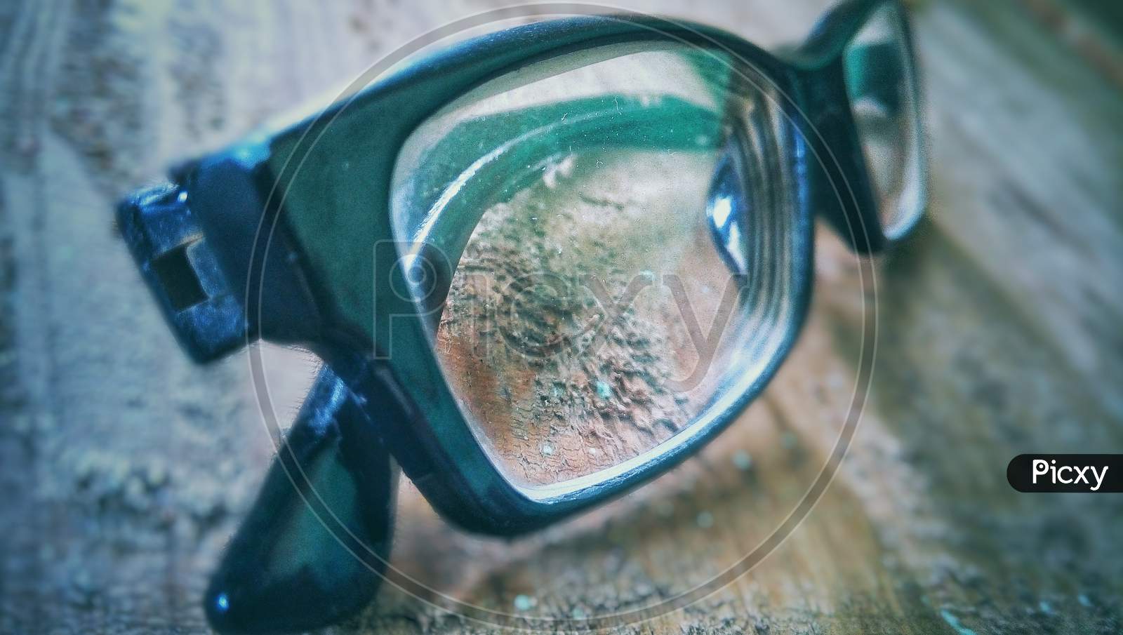 Specs frame images wooden background