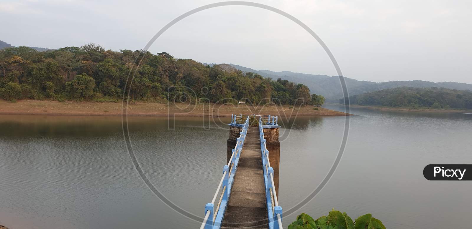 Walkway Bridge at Vazhani Dam Reservoir In Kerala, India.
