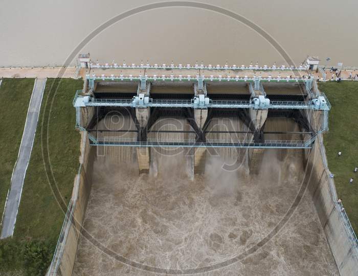 Close Up Aerial Bird Eye Of Water Reservoir Flood Gates Open To Release Water From Dam At Raichur, India