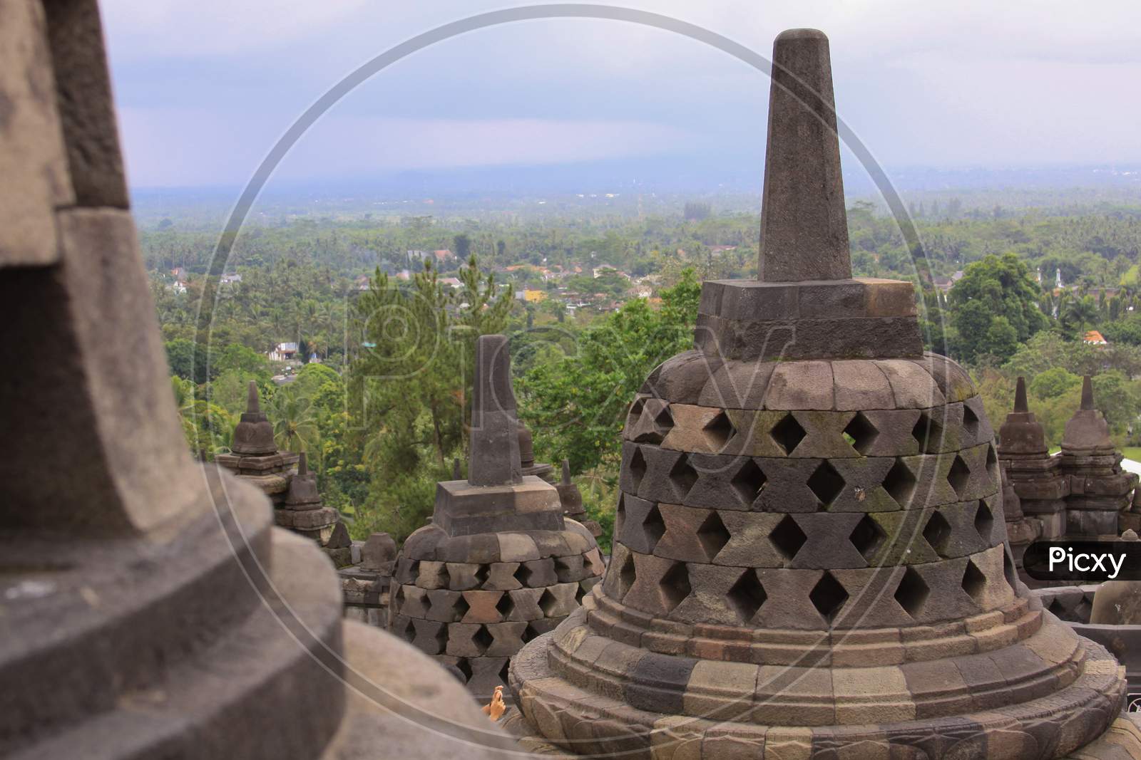 Stupas And Mountains At Borobudur Temple Sunset