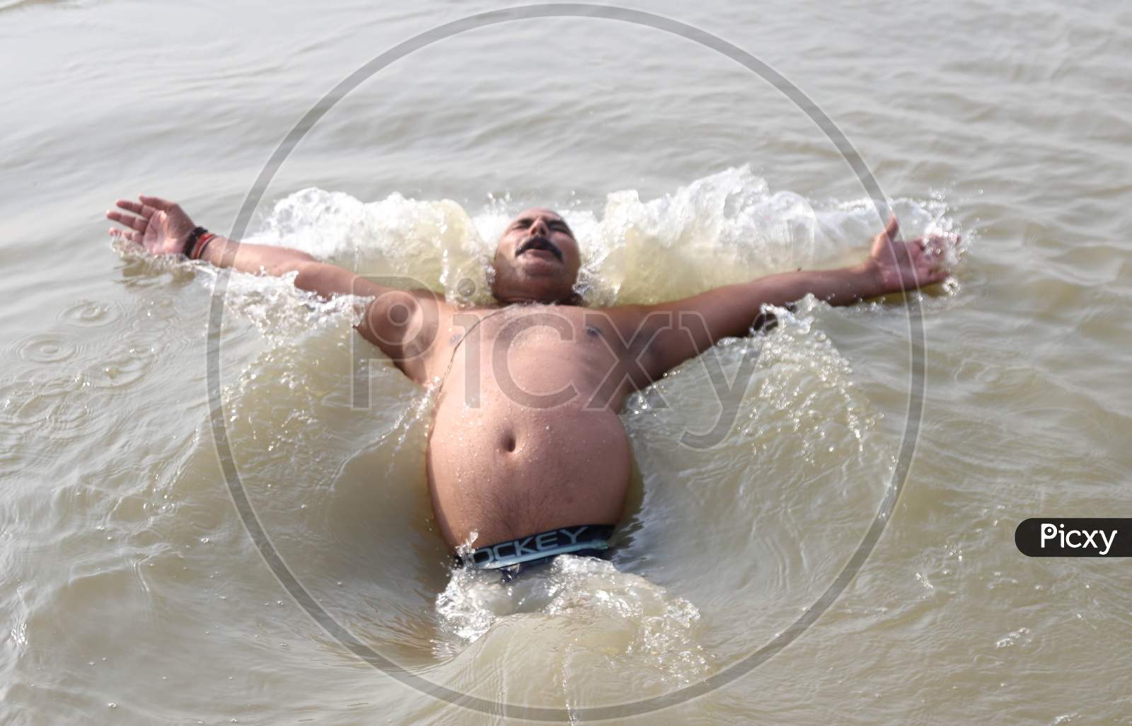 A Man Jumps In The River Ganga To Beat The Heat On A Hot Day In Prayagraj, June 10, 2020.