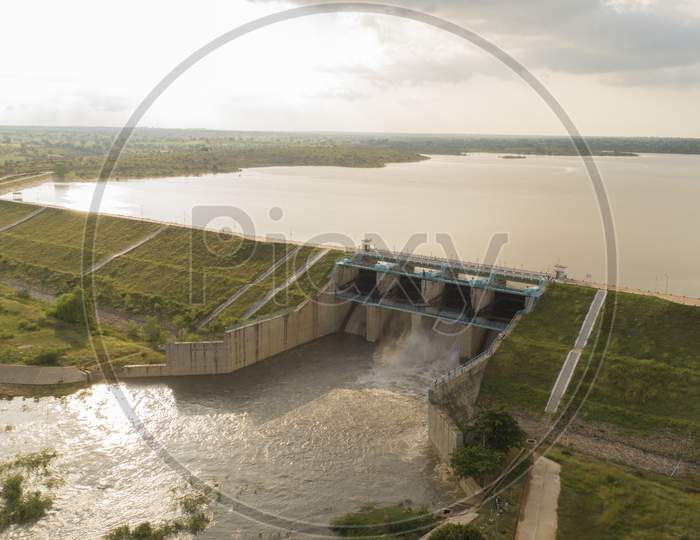 Aerial View Of Water Reservoir With Full Of Water And One Of Flood Gate Open At Raichur, India