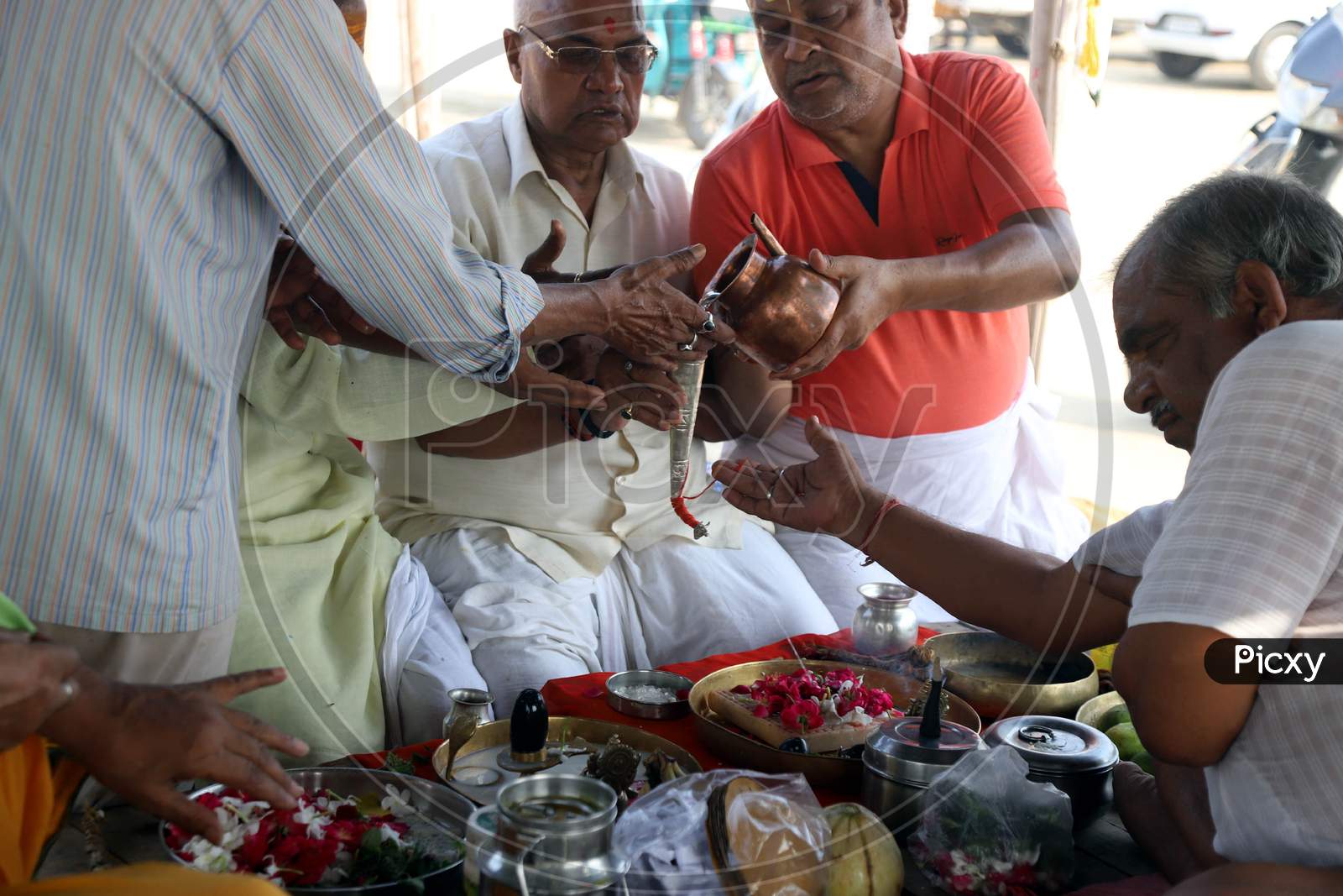 Hindu Devotees Offering Rudrabhishek After Taking  Holy Dip In The Ganga River During Nationwide Lockdown 5.0 for Coronavirus or COVID-19 Pandemic In Prayagraj, June 10, 2020.