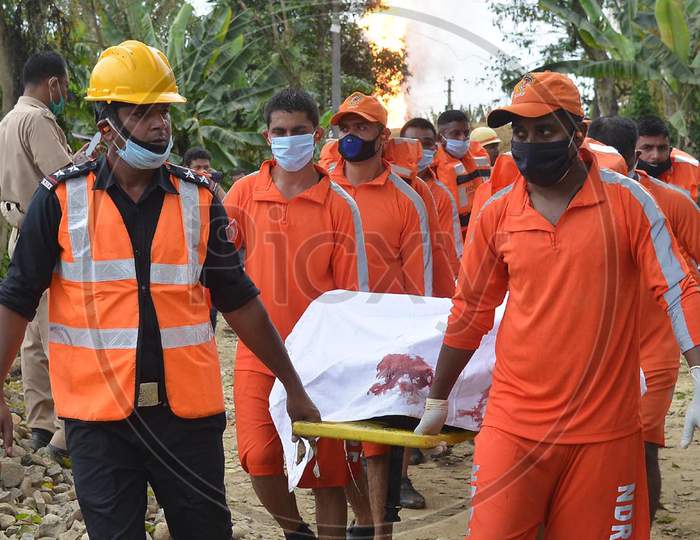 Rescue Workers Recover A Body Of A Worker Following An Explosion At A Well Run By State-Owned Oil India In Tinsukia On June 10,2020.