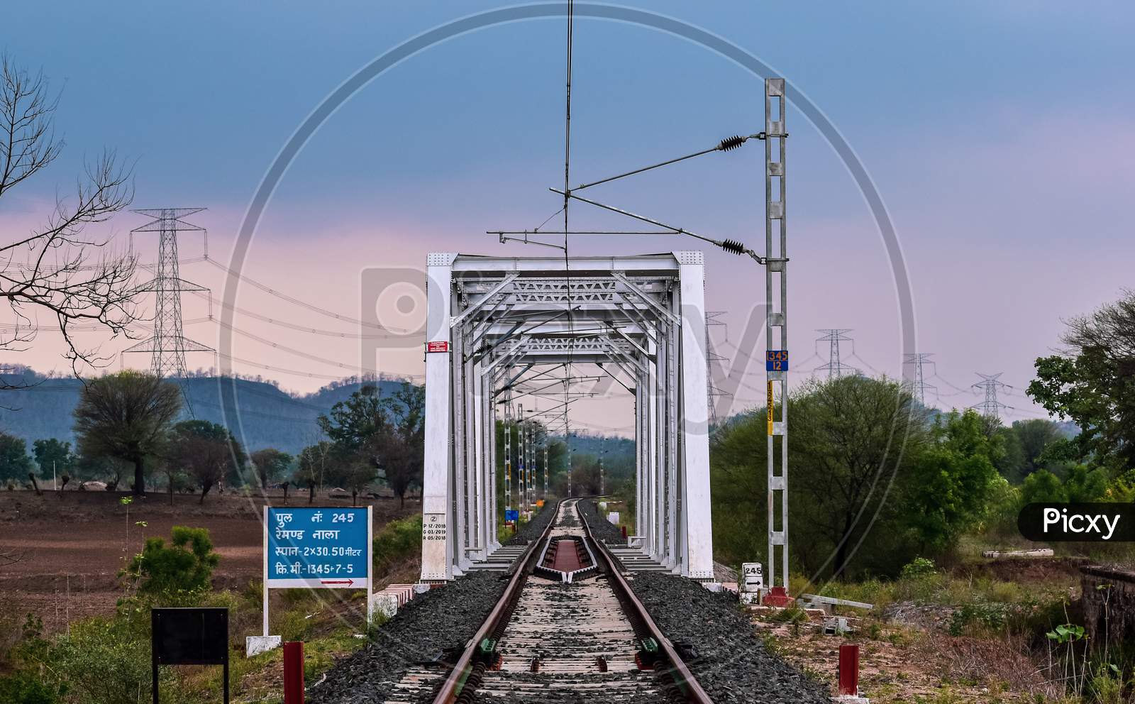 The iron pole bridge for Indian railways with electric polls