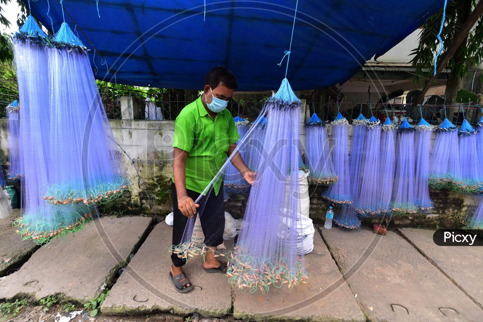 A Vendor Arranges  Fishing Net On His Roadside Shop For Sale During Nationwide Lockdown 5.0 of Coronavirus or COVID-19  In Nagaon District In The Northeastern State Of Assam, India On June 9,2020.