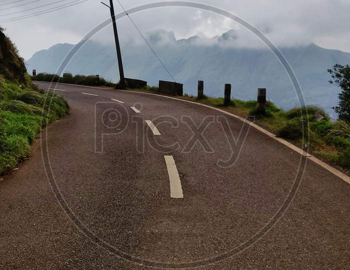 View Of Empty Road Between The Hills In Ponmudi, Kerala, India.