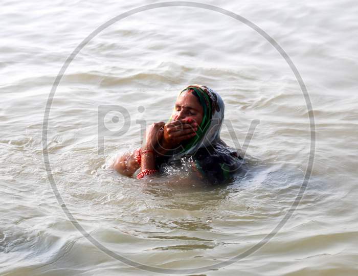 A Woman Takes Bath In The River Ganga To Beat The Heat On A Hot Day In Prayagraj, June 10, 2020.