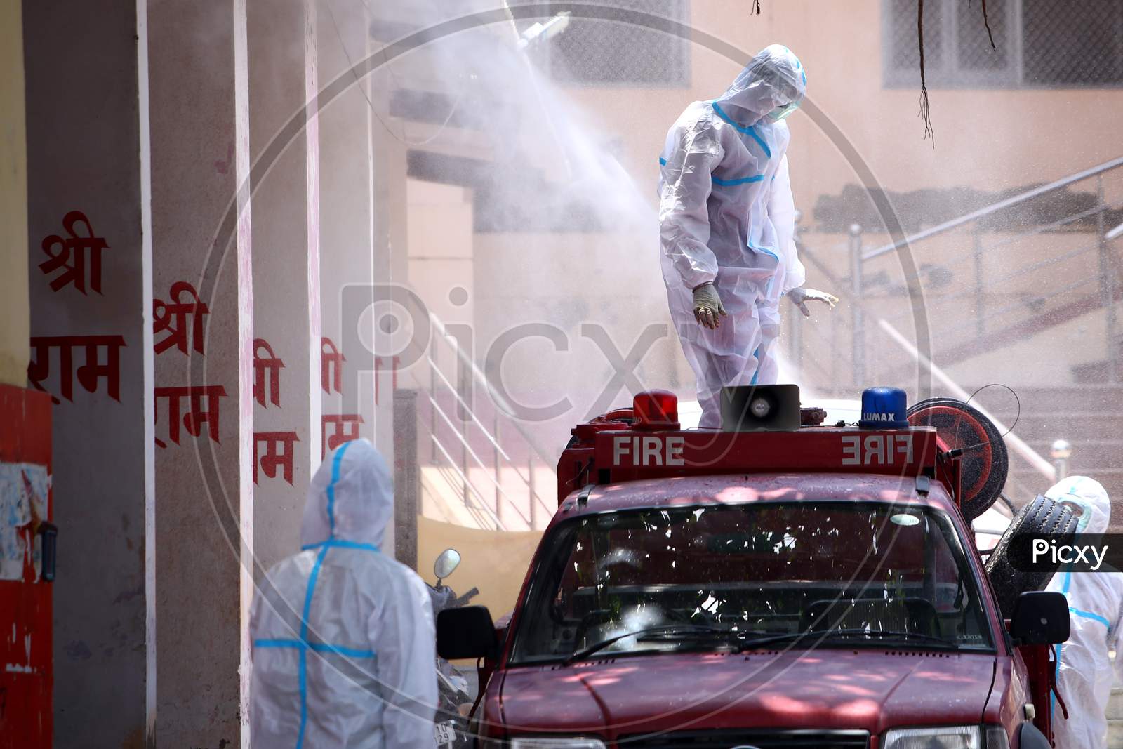 Health Workers Wearing Personal Protective Equipment (Ppe) Disinfect As A Preventive Measure Against The Spread Of The New Coronavirus Covid-19, After A Cremation Of A Woman, Who Died Of Covid-19 In Ajmer, Rajasthan, India On June 9, 2020.