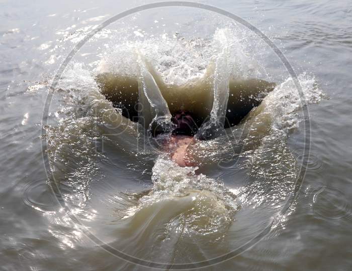 A Man Jumps In The River Ganga To Beat The Heat On A Hot Day In Prayagraj, June 10, 2020.