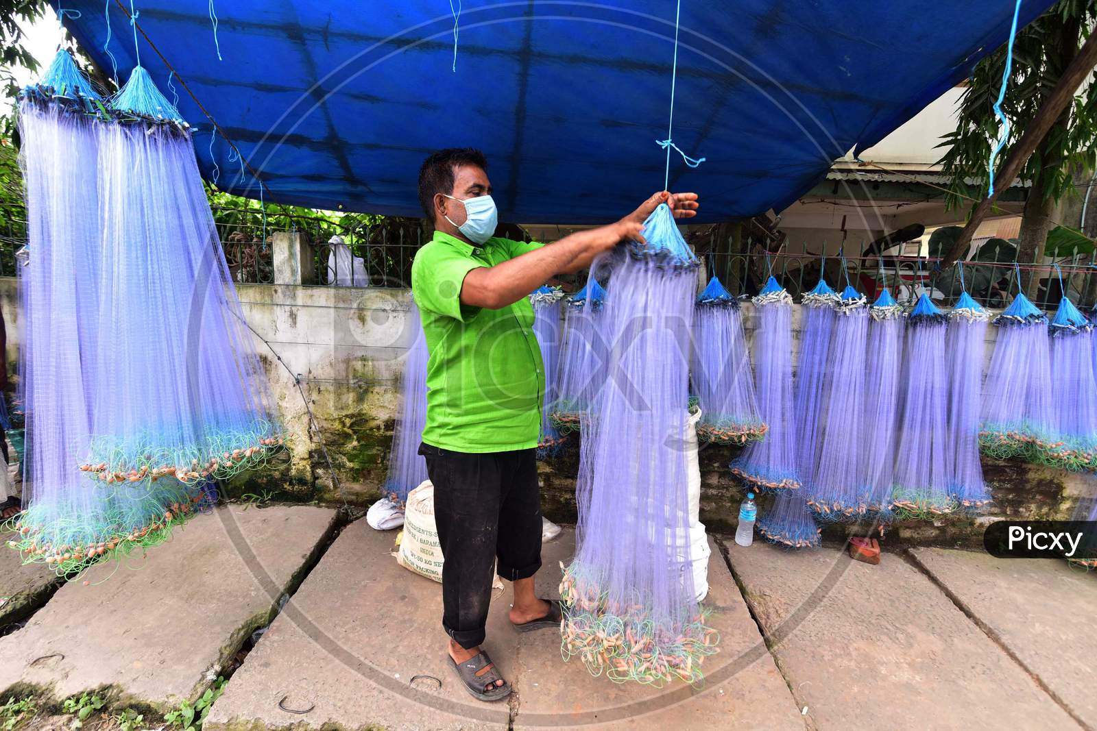 A Vendor Arranges  Fishing Net On His Roadside Shop For Sale During Nationwide Lockdown 5.0 of Coronavirus or COVID-19  In Nagaon District In The Northeastern State Of Assam, India On June 9, 2020.
