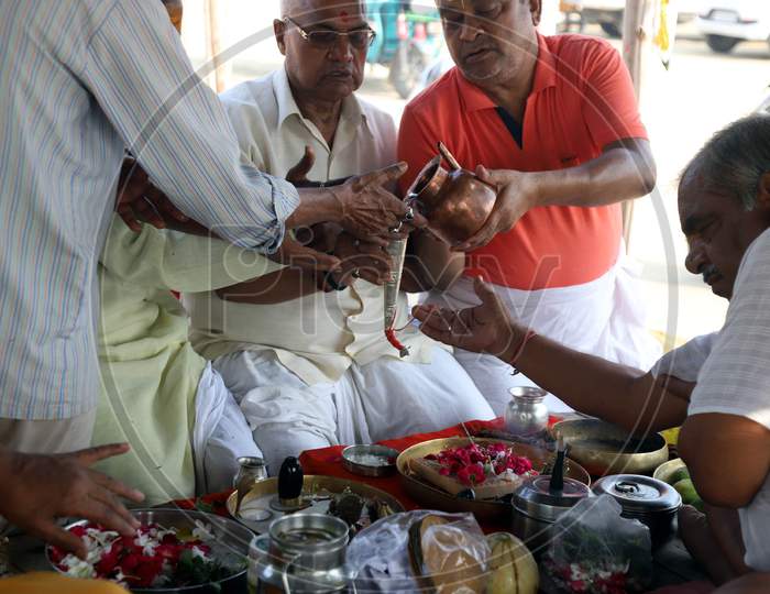 Hindu Devotees Offering Rudrabhishek After Taking  Holy Dip In The Ganga River During Nationwide Lockdown 5.0 for Coronavirus or COVID-19 Pandemic In Prayagraj, June 10, 2020.