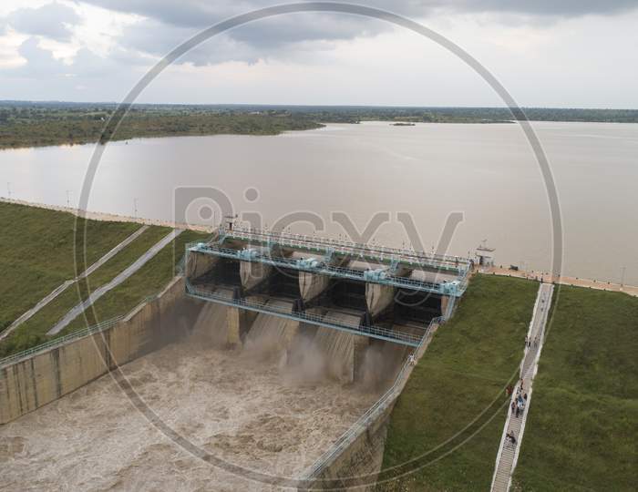 Aerial Bird Eye Of Water Reservoir Flood Gates Open To Release Water During Monsoon Flood From Dam At Raichur, India