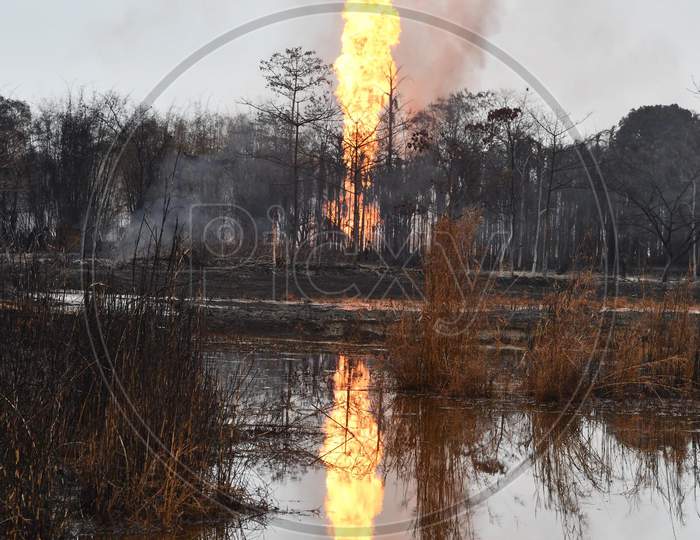 Flames And Smoke Come Out From A Well Run By State-Owned Oil India In Tinsukia District Of Assam On June 10,2020