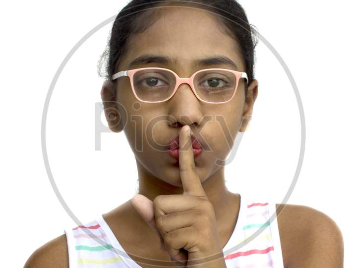 Portrait of a Young Indian Girl with Silence Indication