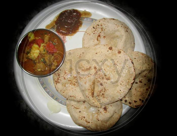 Eggs with roti , ande ki sabji in thali ,wheat Chapati with egg curry