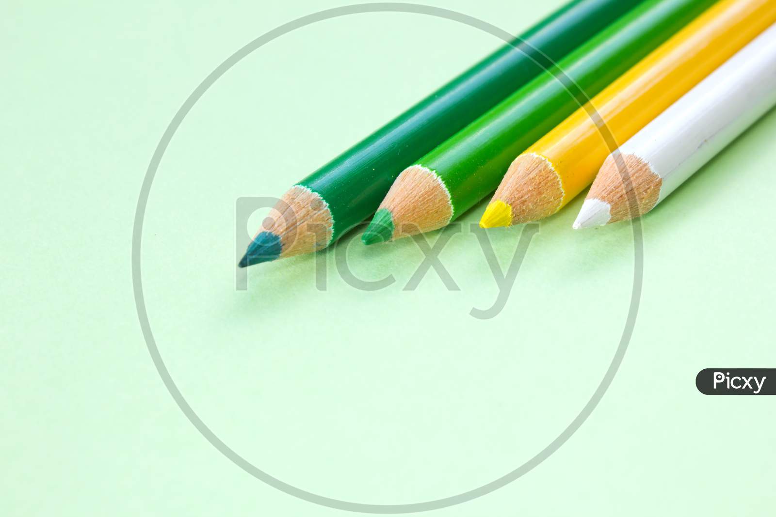 Colour Pencils on a green colored background